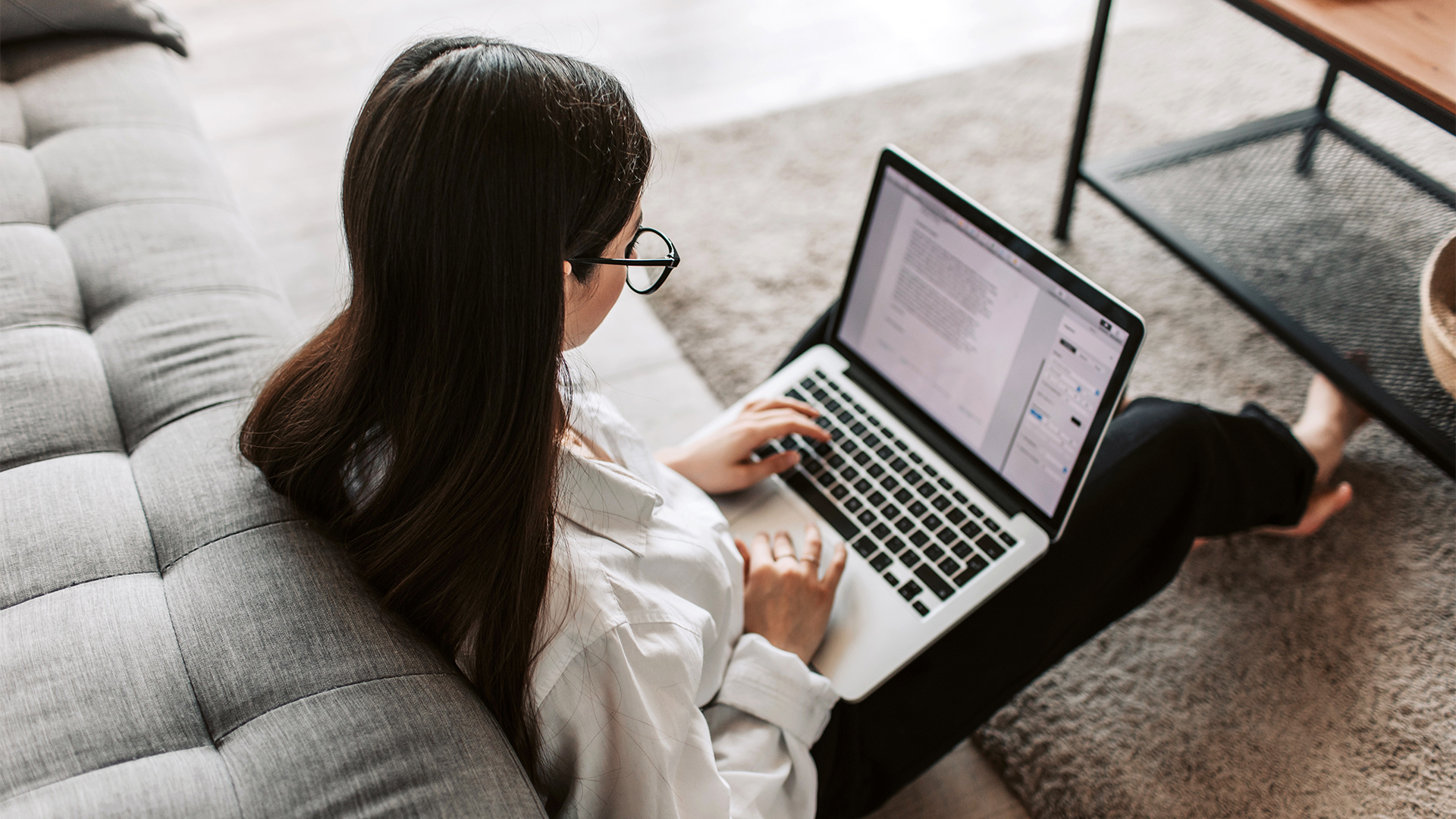 Woman-Sitting-with-Laptop
